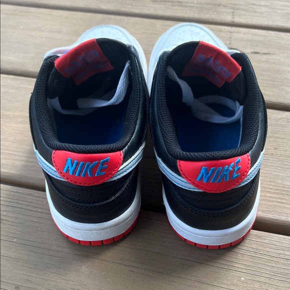 This is a Nike Dunk Low GS \'Spider-Man\' sneaker.